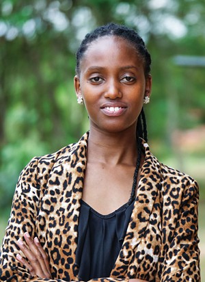 Claudine Kamanzi, a young woman, smiles to the camera.
