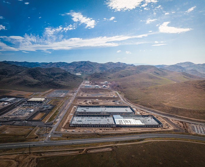 Several warehouses being built in the Nevada desert.