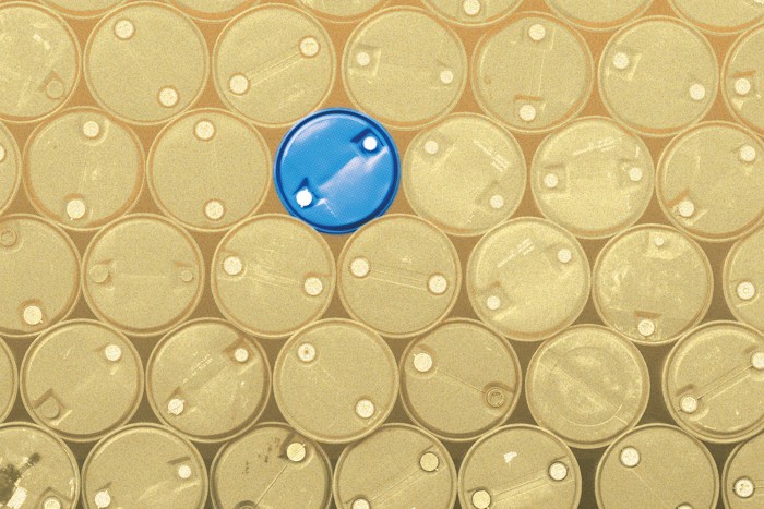 An image of gold colored barrels and one blue barrel near the center