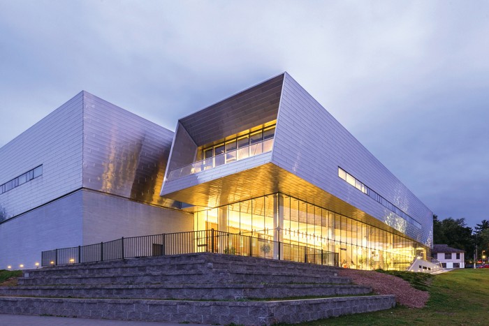 The Isabel building has an ethereal glow as dusk falls.