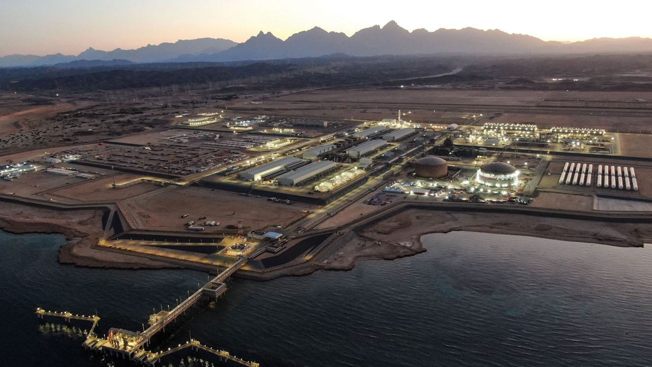 An aerial view of a massive industrial complex on Saudi Arabia’s coast at dawn.