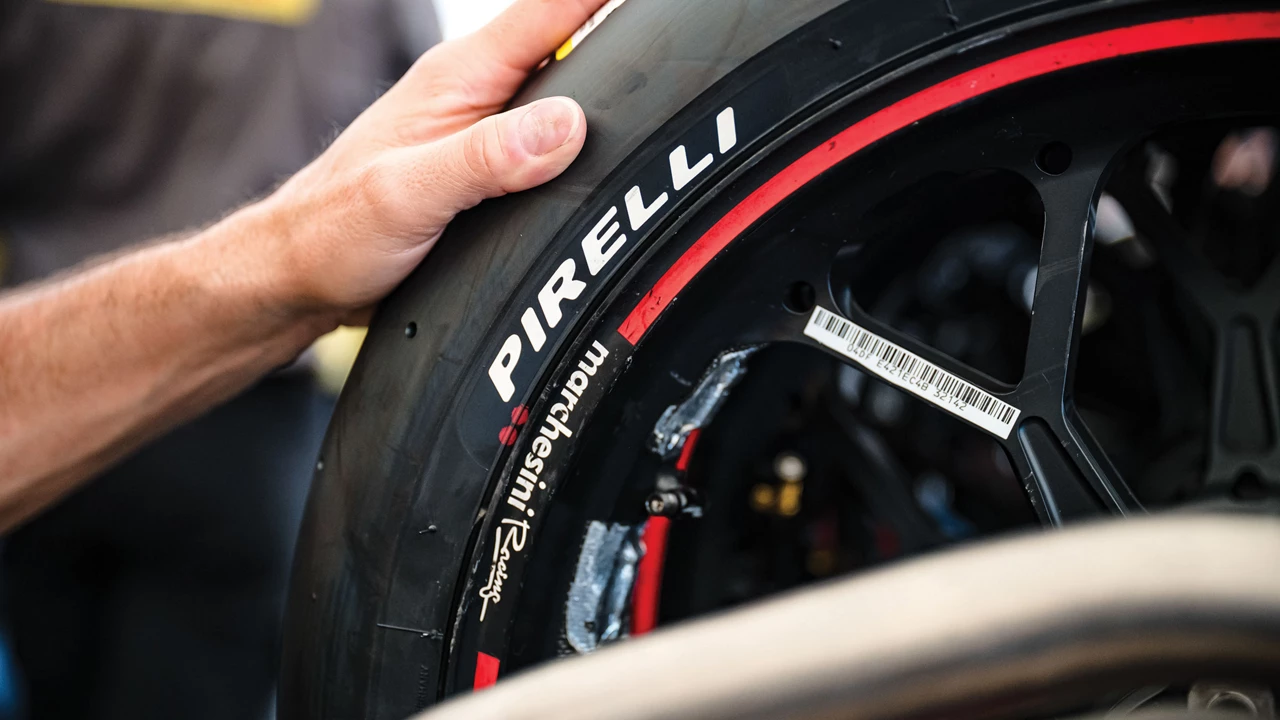 A close-up of a high performance tire with the Pirelli logo on it.