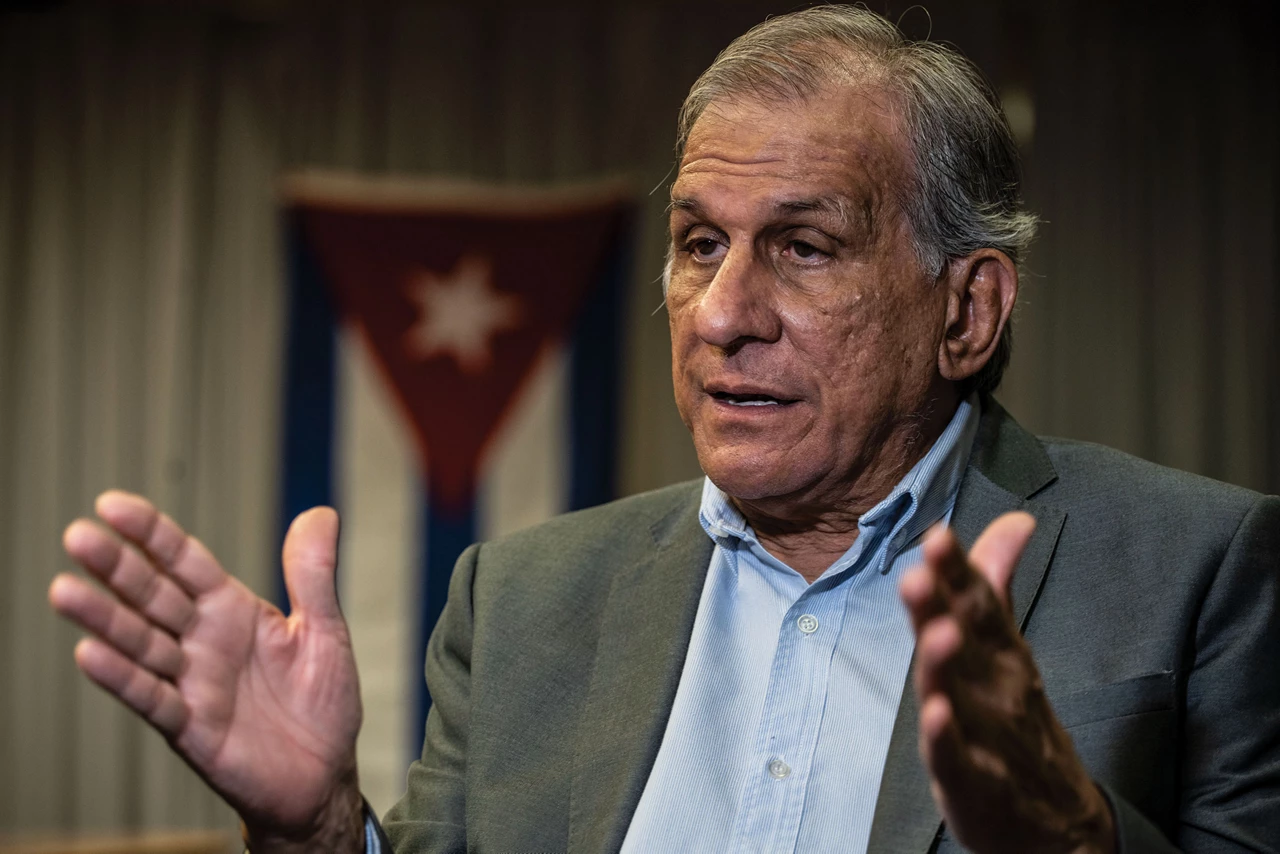Mitchell Valdés-Sosa wearing a blue collared shirt and a suit jacket. 