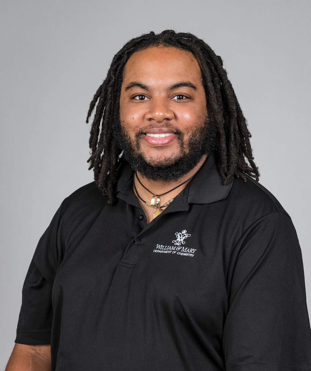 Portrait shot of Isaiah Speight, who wears a beard and a black shirt.