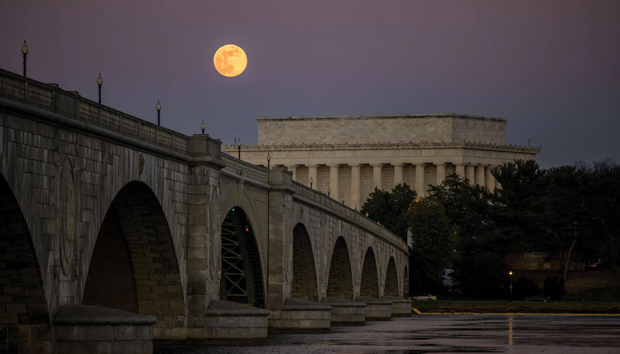 A full moon is seen over the Lincoln Memorial and Arlington Memorial Bridge in Washington, DC.