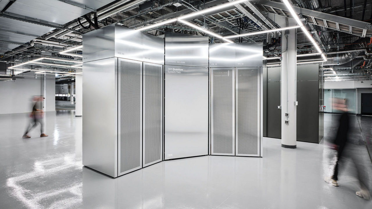 A large metallic quantum computer module stands inside a spacious building.