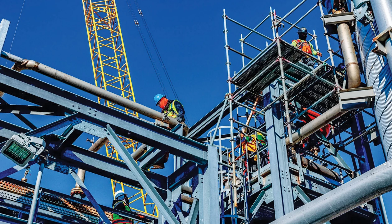 Workers on a steel girder structure.