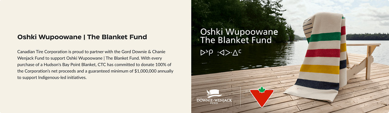 Hudson's Bay Point Blanket is draped on a Muskoka chair highlighting the Oshki Wupoowane Blanket Fund charity. 