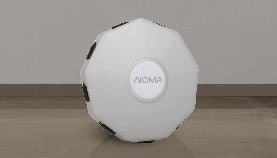 A NOMA 8-in-1 solar panel hub sitting on a hardwood floor.