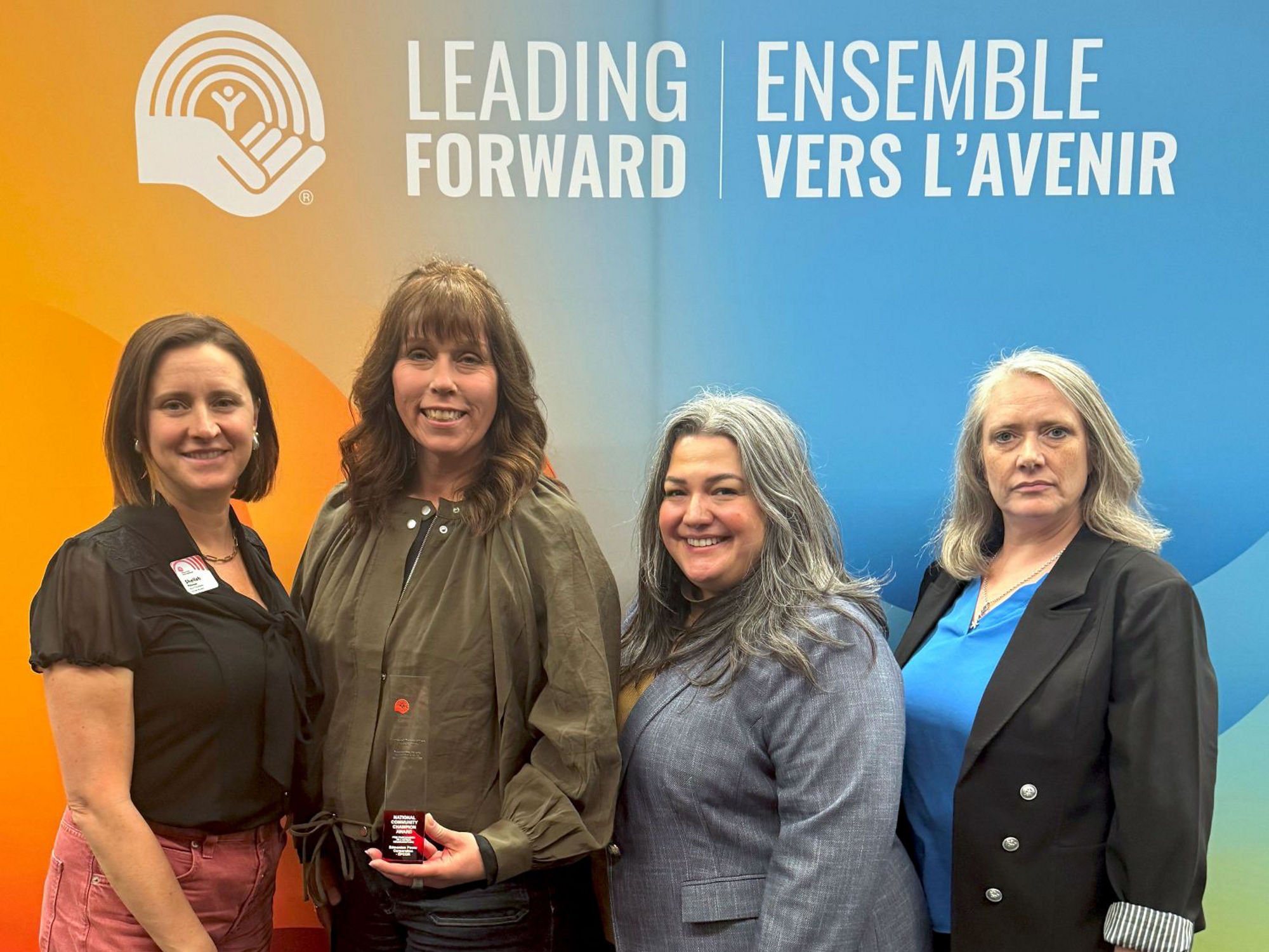 Gillian Adams (second from the left) stands alongside members of the United Way after accepting the National Community Champion Award on behalf of EPCOR.