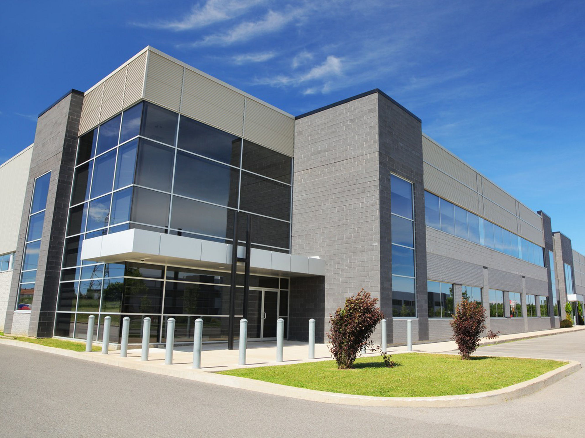 A large modern commercial building with blue sky