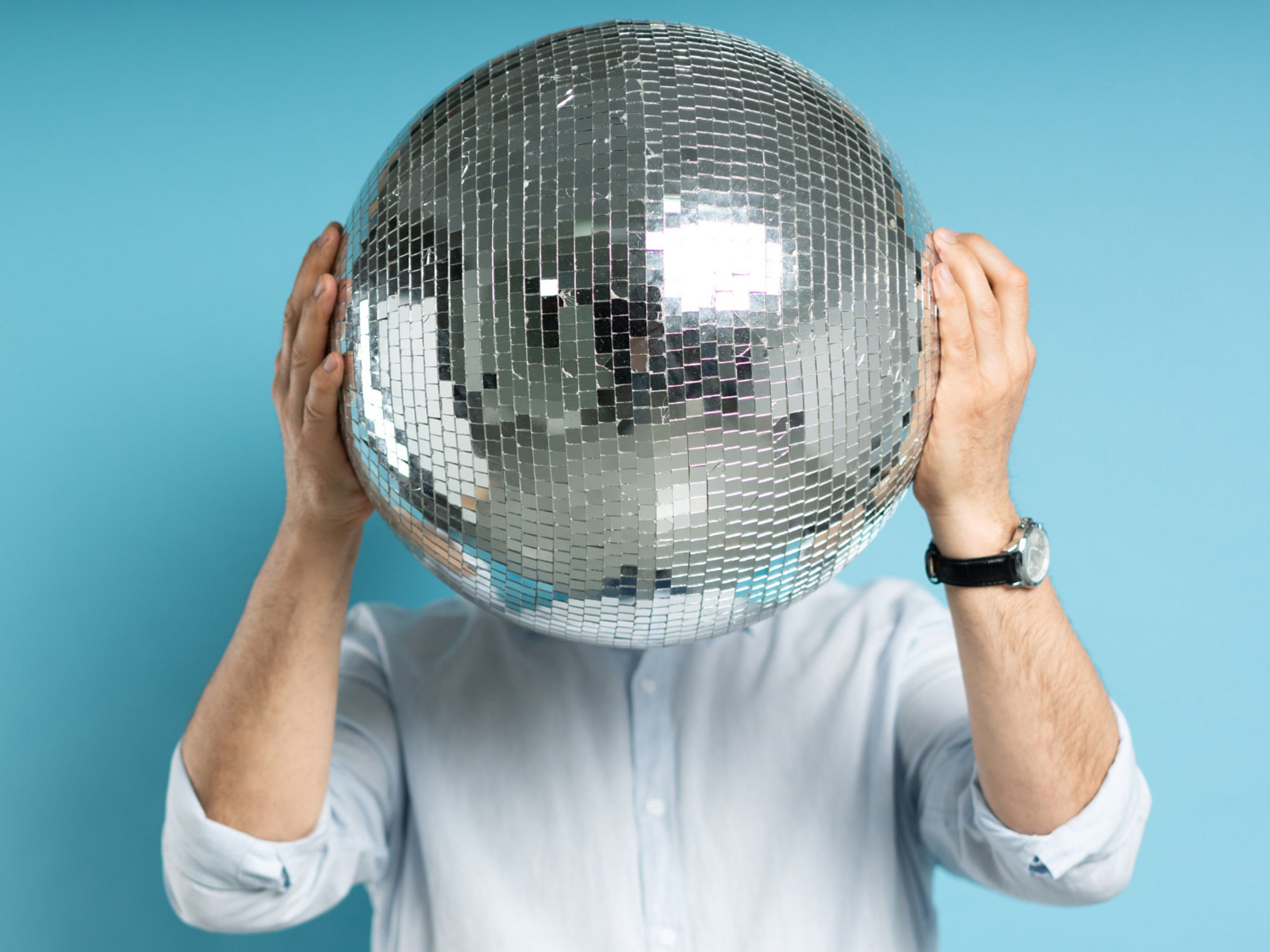Encor Images  - Man holding disco ball - Encor Contest 