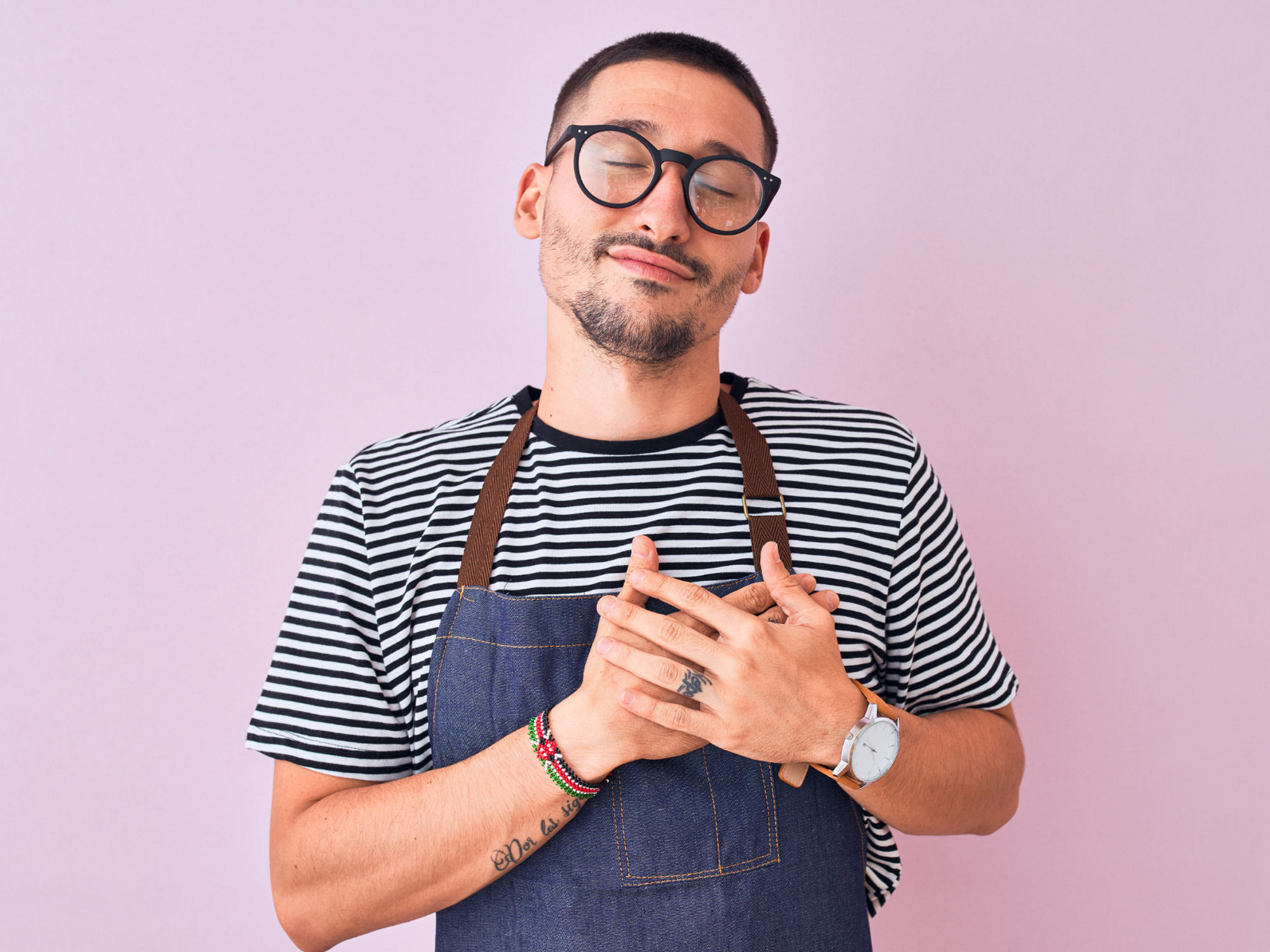 Encor Images  - man in apron hands on heart