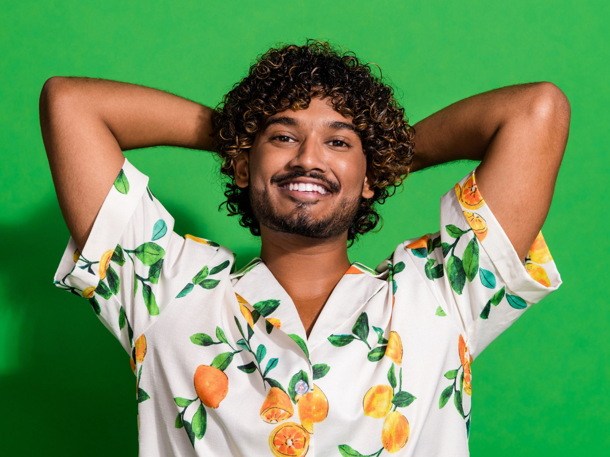 Encor Images  - Man relaxing green background - Main Encor Page