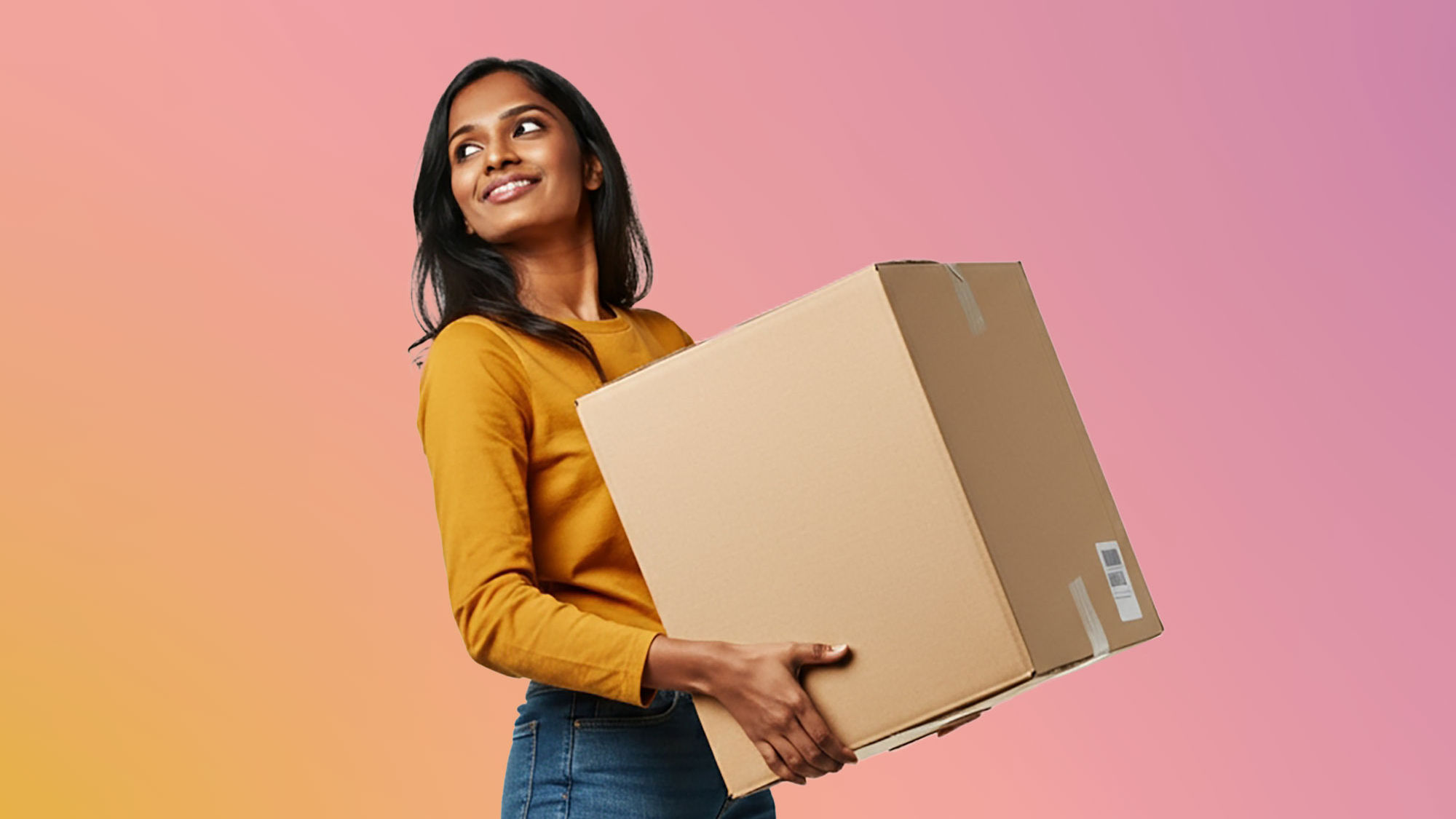 A person carries a cardboard moving box, representing a residential move, home setup, or relocation to a new address.