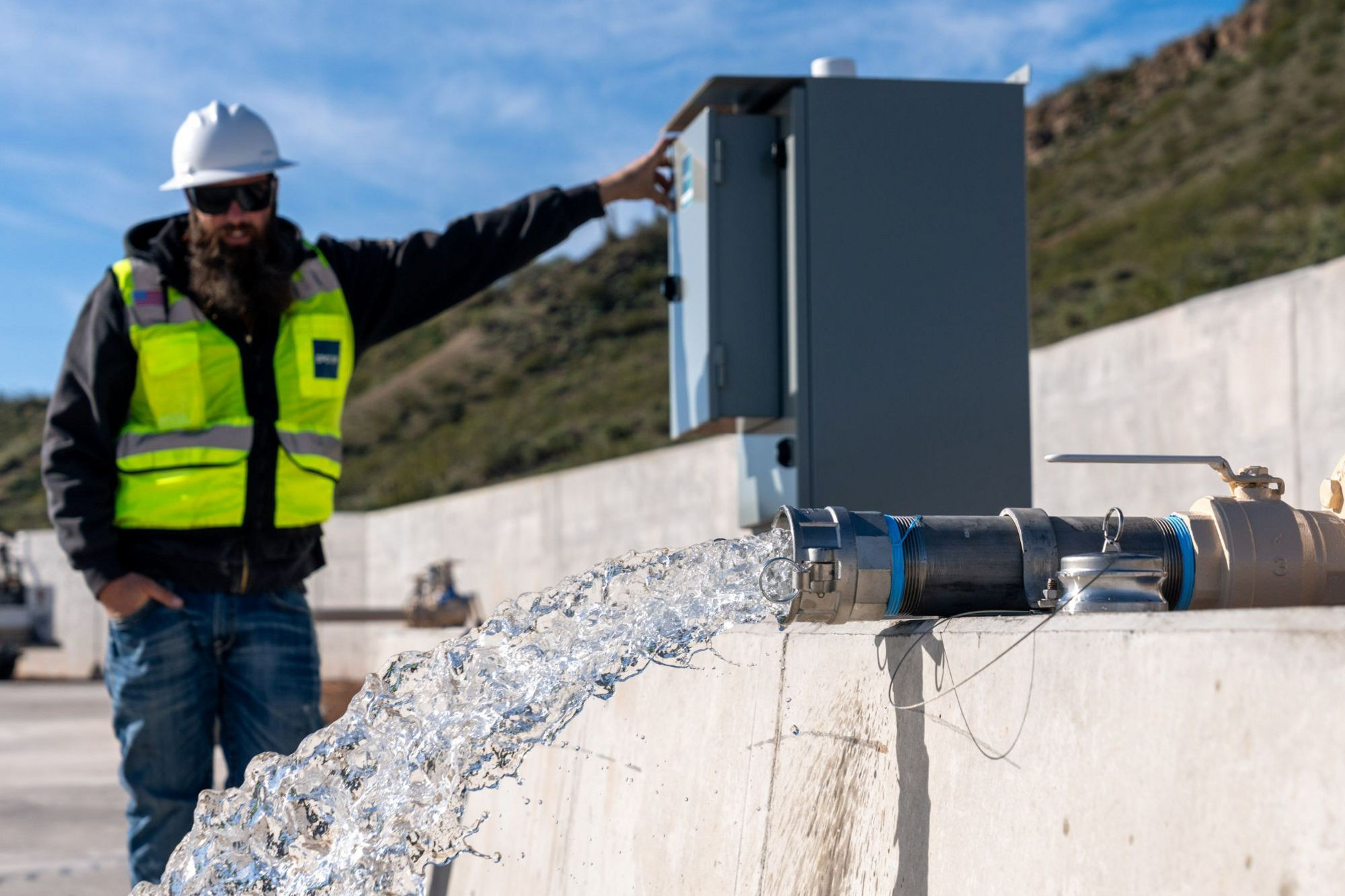 EPCOR worker stands next to the Rio Verde Foothills standpipe
