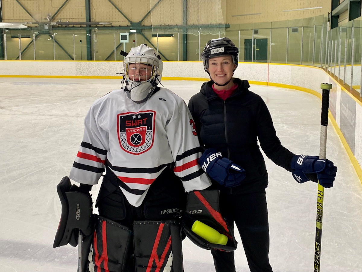 Robyn takes to the ice with her son, stepping up to support youth sports and the community they build.