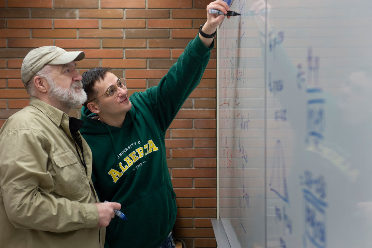 Transition Year Program student and math tutor working out a calculus problem