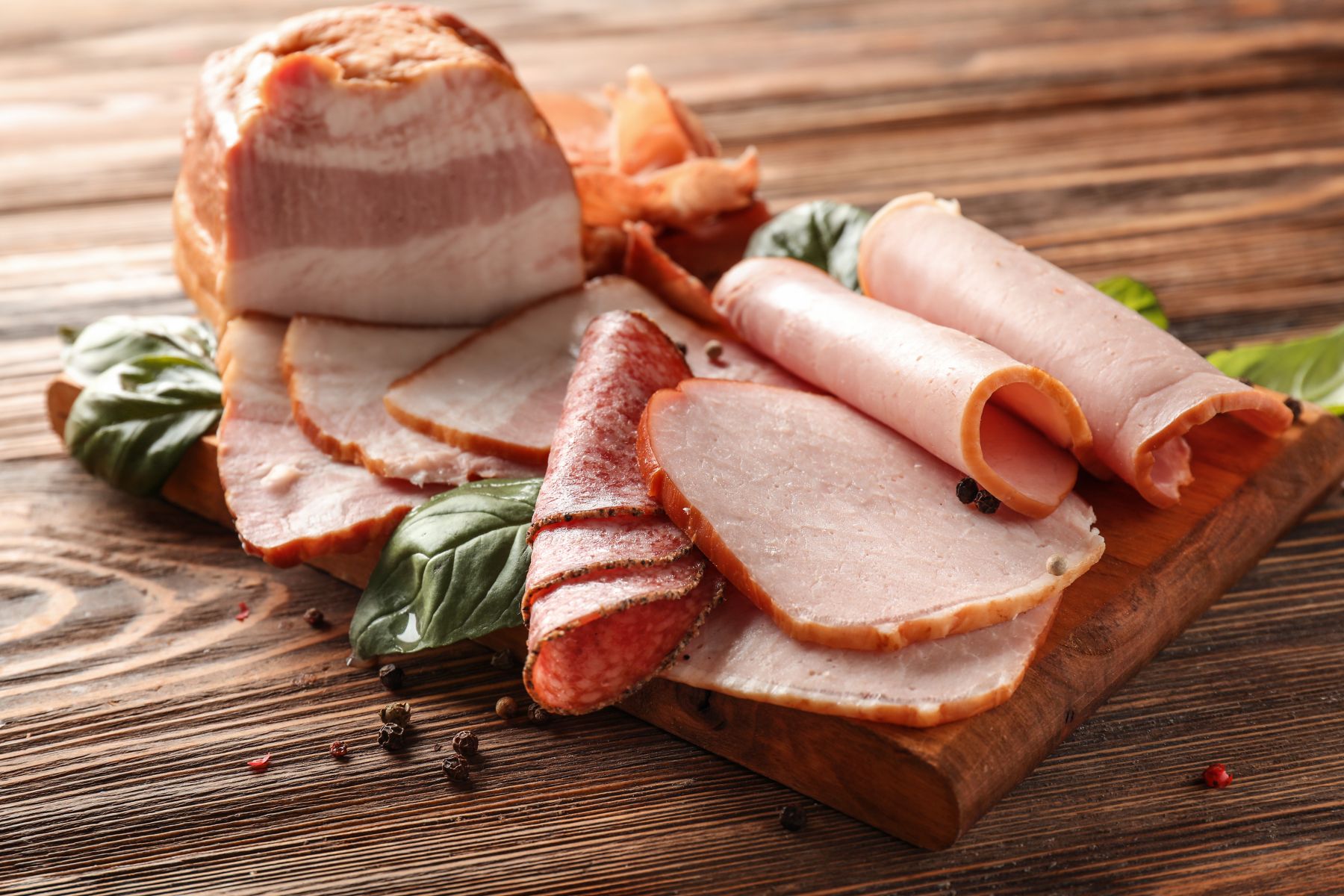 Tasty Sliced Deli Meats on Wood Table