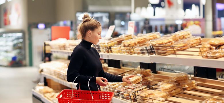 Woman choosing bread  from a supermarket