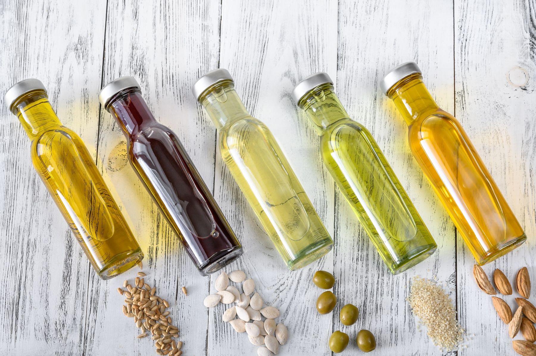 Assortment of vegetable oils in bottles; Shutterstock ID 1643191165; purchase_order: KFT; job: Asian; client: Marketing