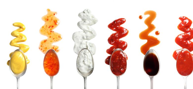 Set of spoons with different delicious sauces on white background, top view; Shutterstock ID 1446769997; purchase_order: KFT; job: Asian; client: Marketing