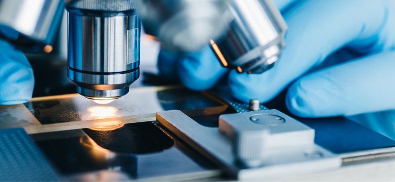 Close-up shot of microscope with metal lens at laboratory.; Shutterstock ID 1014984955; purchase_order: -; job: -; client: -