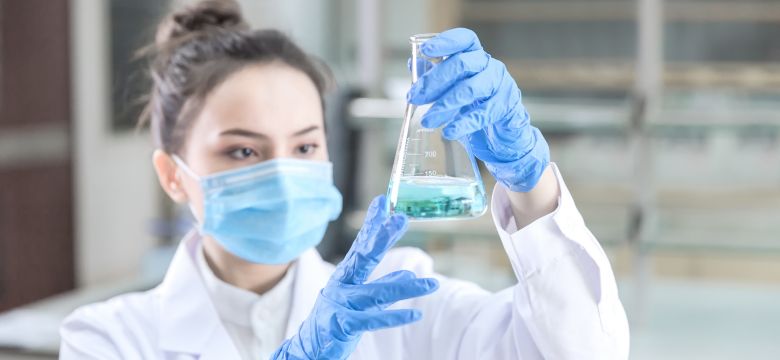 Female scientist looking at the scientific sample in the laboratory; Shutterstock ID 1027796005; purchase_order: -; job: -; client: -