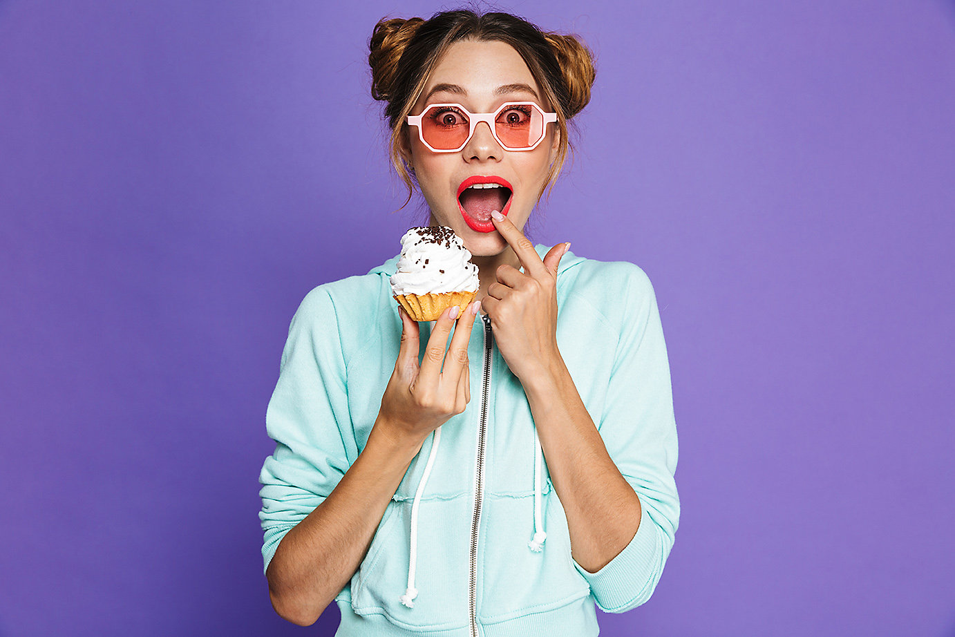 person eating cupcake