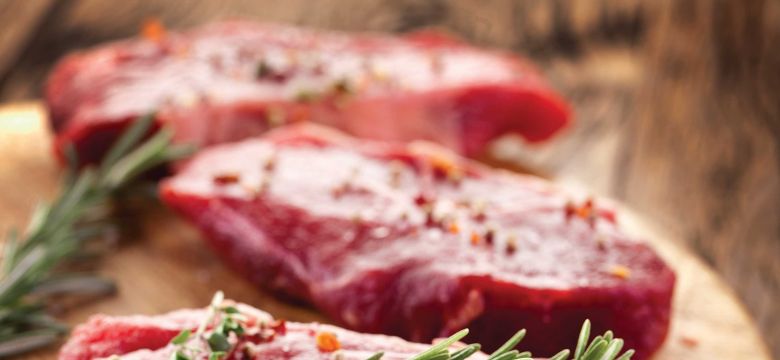 raw steak with rosemary