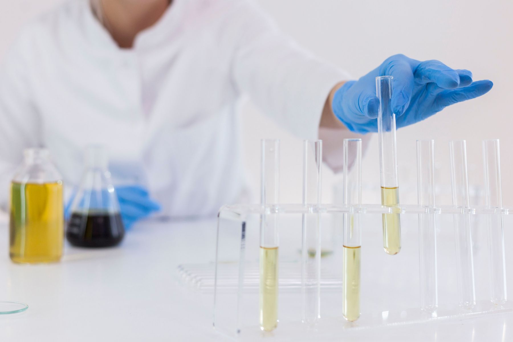 Closeup of a female scientist in a laboratory working ona experiment with cbd oil extracted from a marijuana plant. Healthcare pharmacy from medical cannabis.; Shutterstock ID 1411252202; purchase_order: -; job: -; client: -