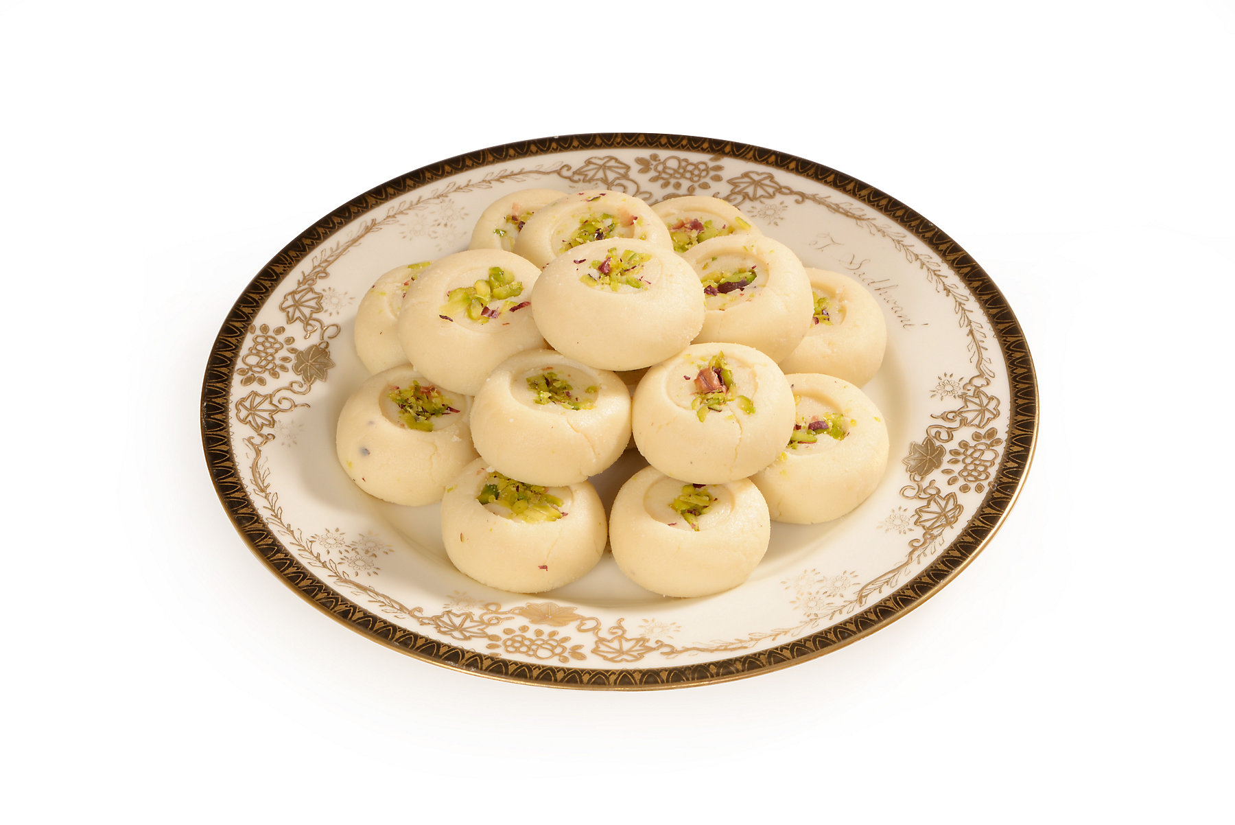 Malai sweet cow milk peda with pistachio garnishing in old vintage plate 