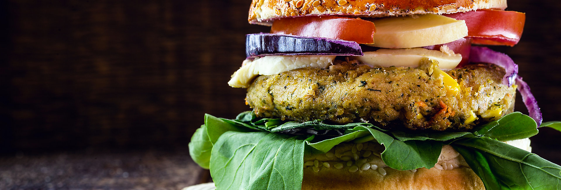 vegan burger on rustic wooden table, with vegetable burger and meat flavor. Healthy vegan food.; Shutterstock ID 1738054679; BU: kft; Region: south america; Purpose: blog article