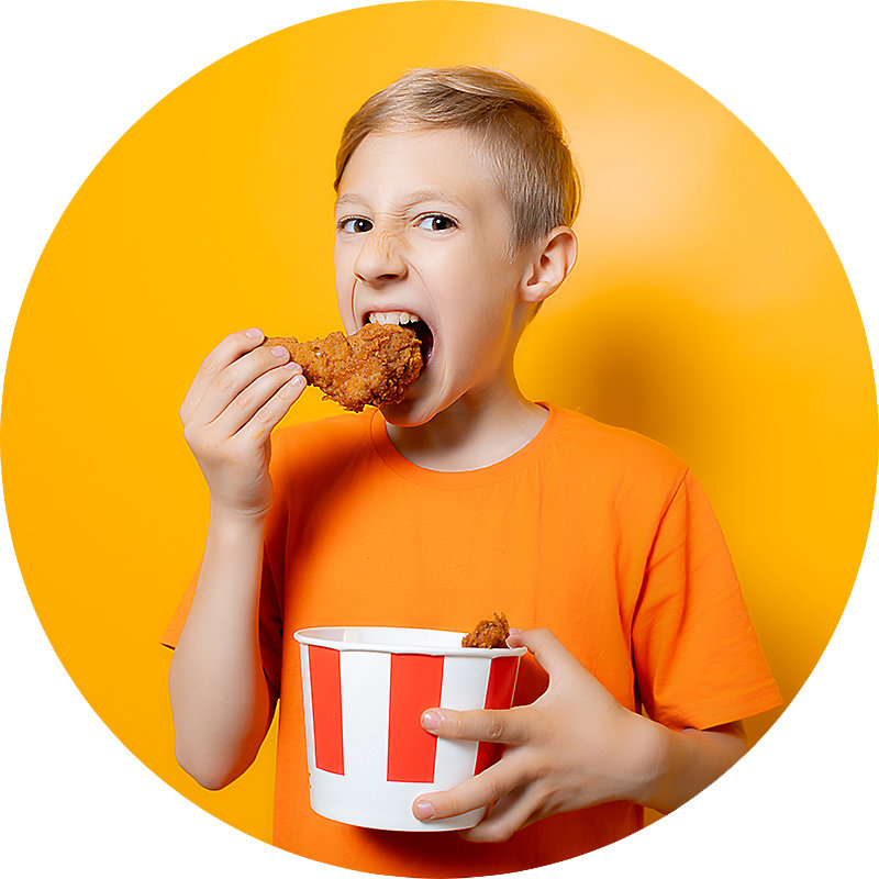 Boy eating fried chicken