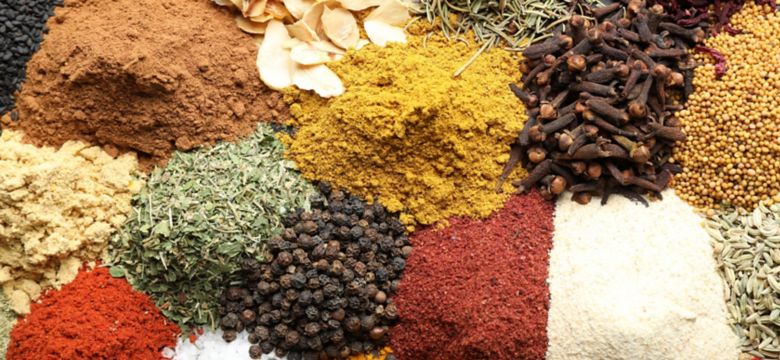 Many different spices as background, top view