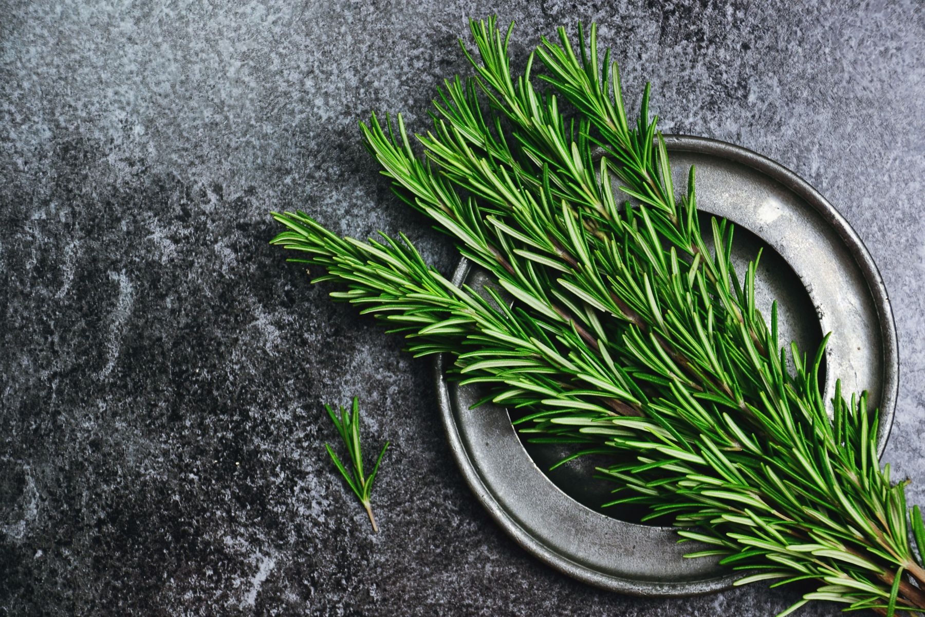 Fresh rosemary herb on the dark background. Top view rosemary; Shutterstock ID 796048429