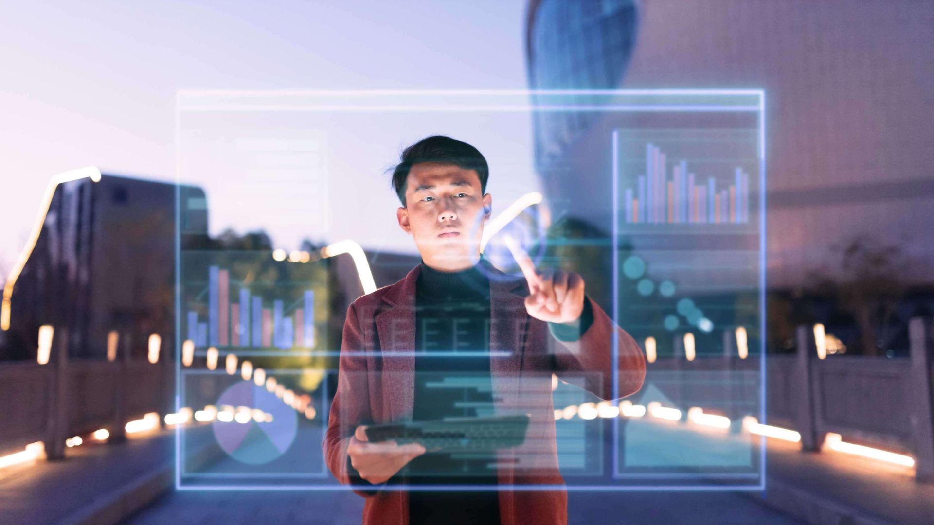 Man using tab and working on glass screen