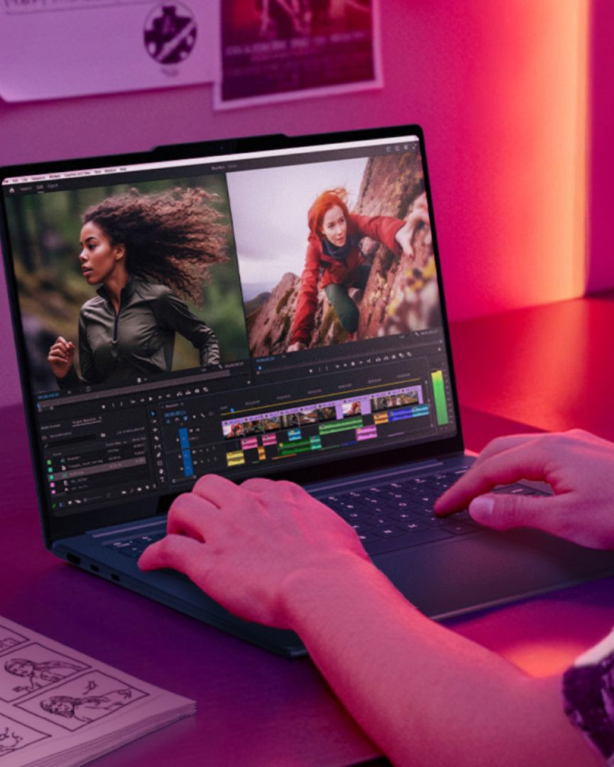 Person editing video on Yoga Pro 7 laptop.