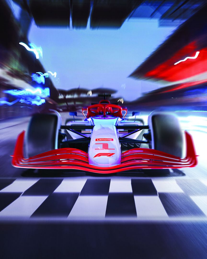 Formula 1 race car on track with blurred background.