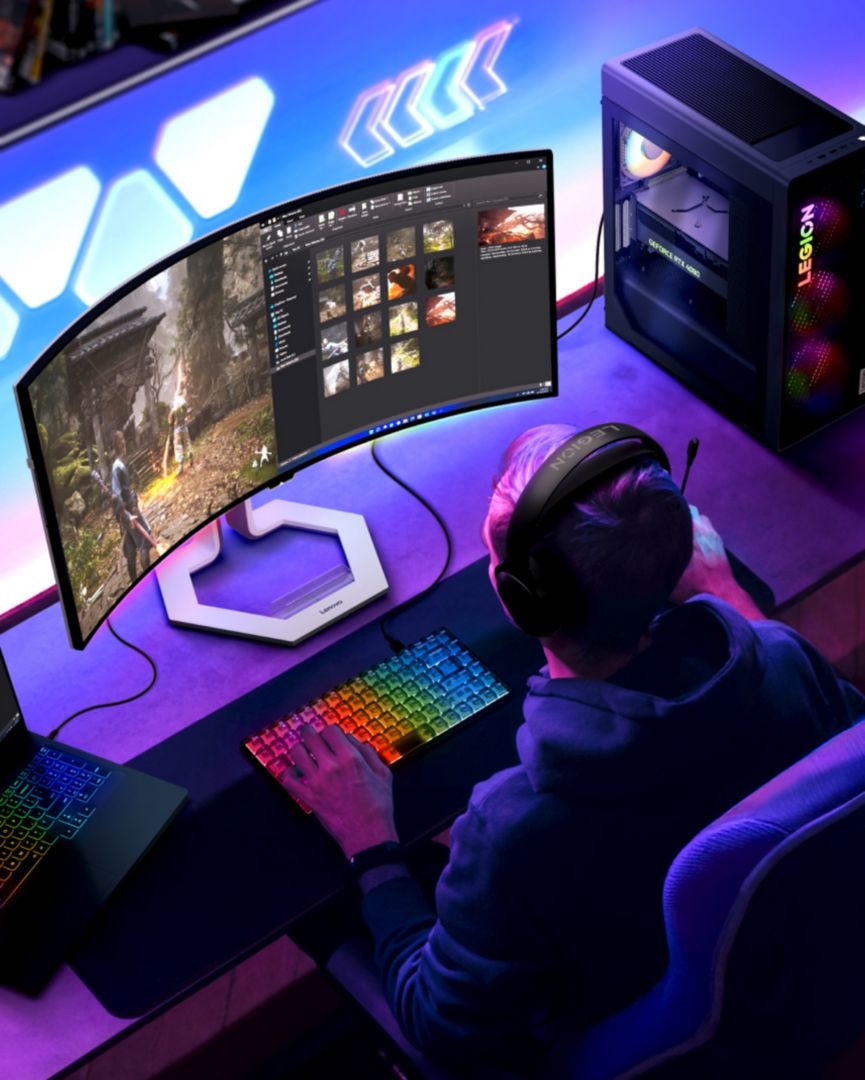 Man playing video games on a Legion device. 