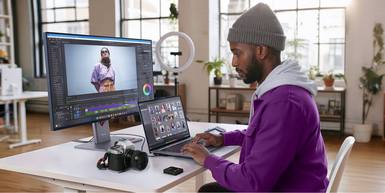 A student working on a photography project on his workstation.