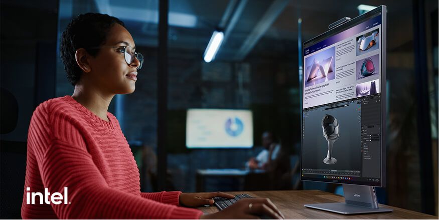 A woman using a Workstation in a dark office, the Intel logo in the corner.