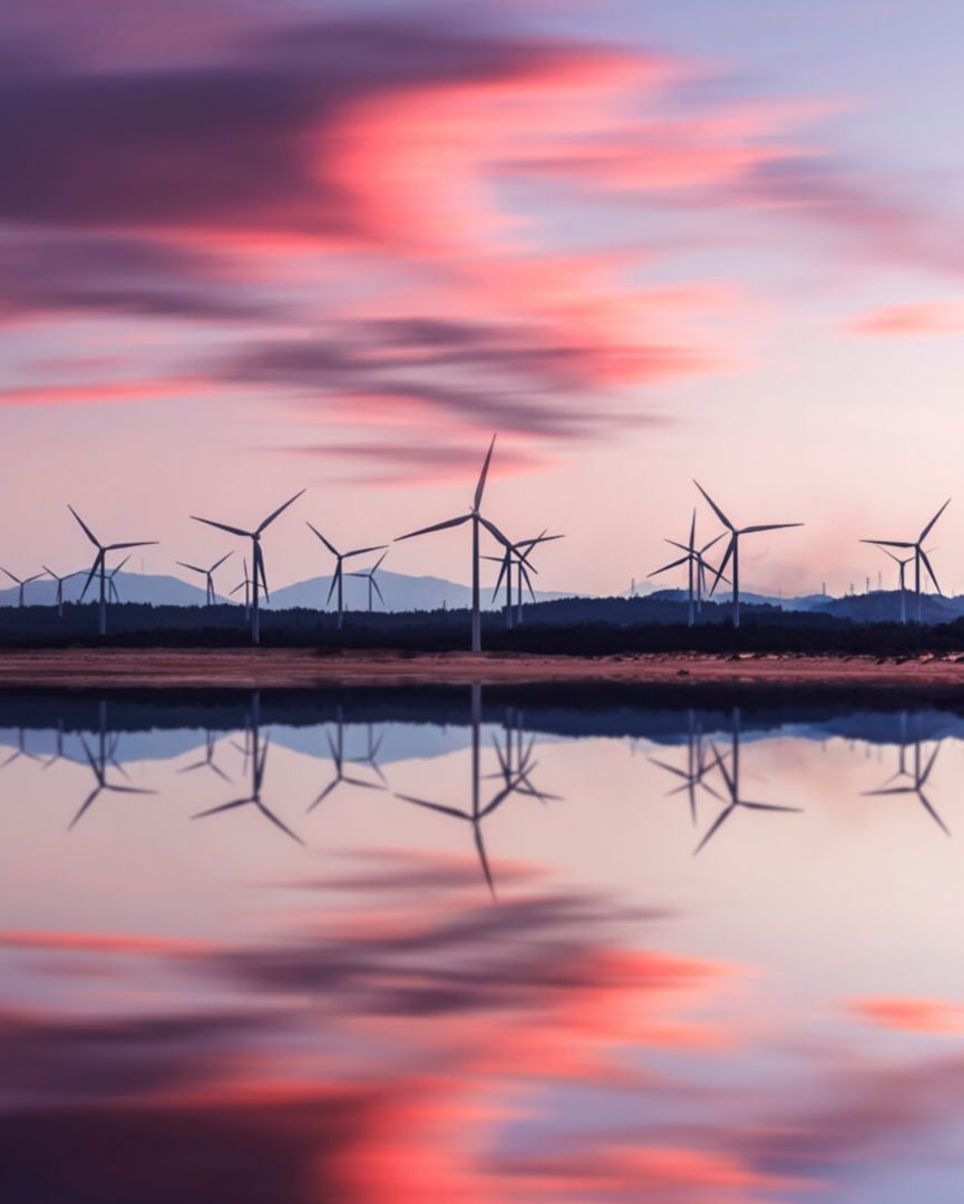 Wind farm in the distance during sunset.