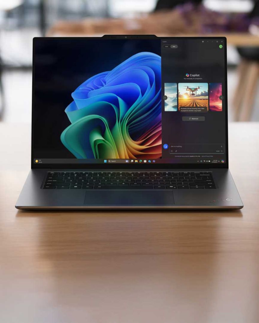 A laptop screen with a colorful swirling image. 