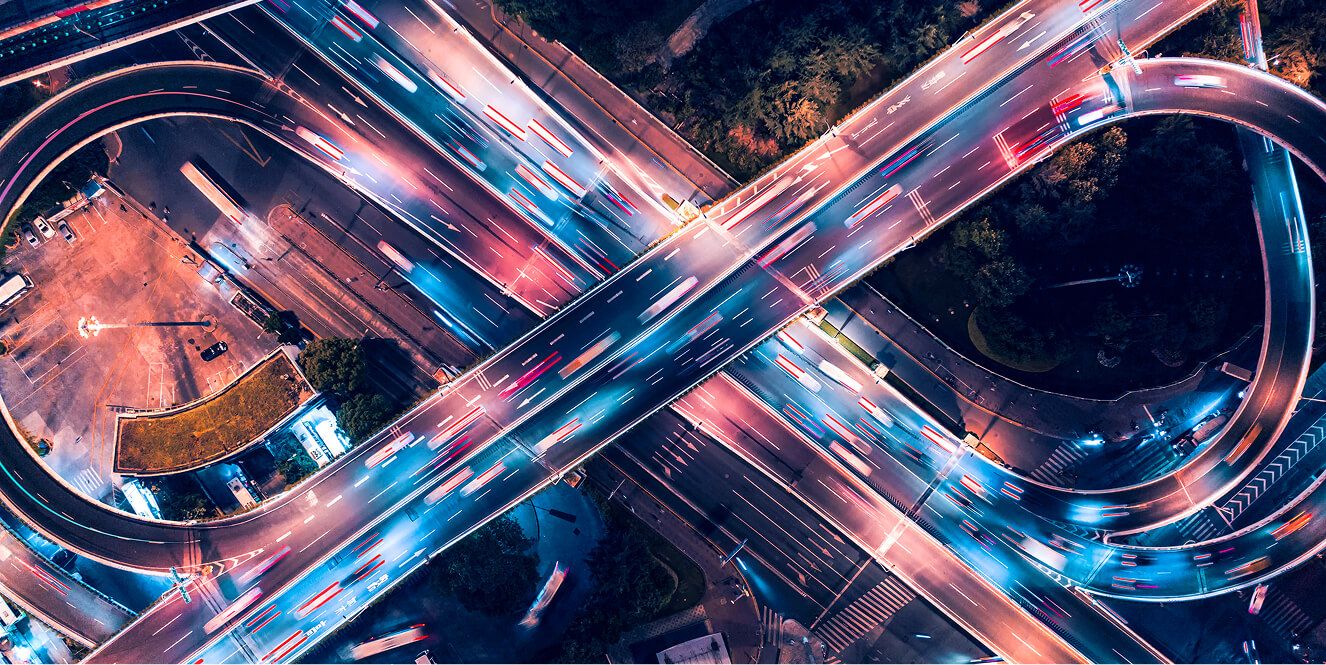  A time lapse of a cloverleaf traffic pattern at night.