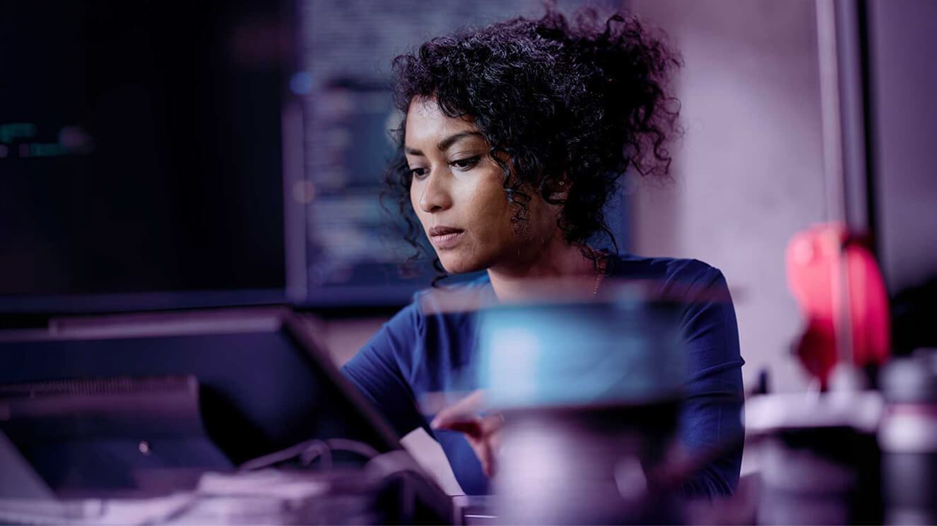 A woman working on her computer.