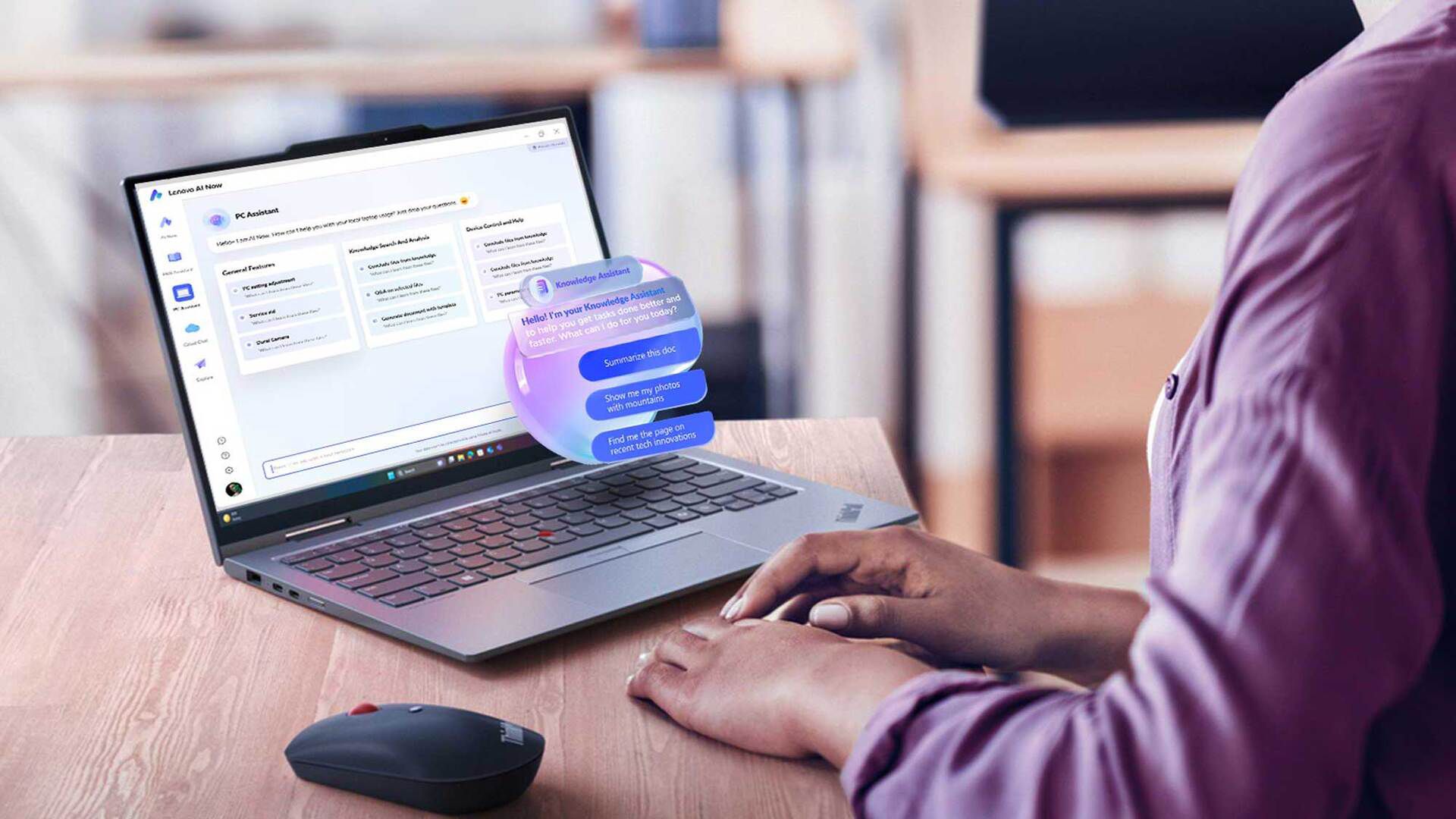 Hands using a laptop with an inset of an AI digital assistant helping.