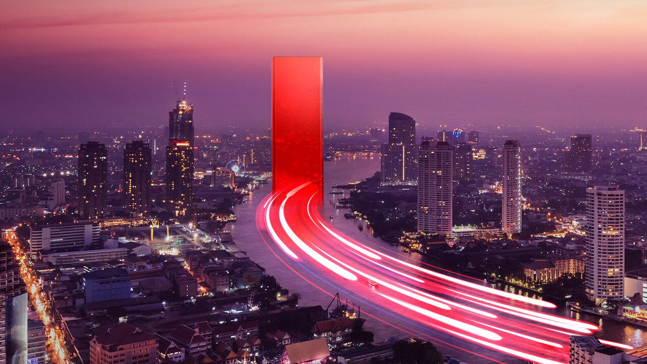City scape with blurred lights from car movement heading into Lenovo Portal.