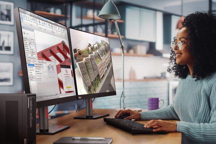 A women working at her desk on a desktop