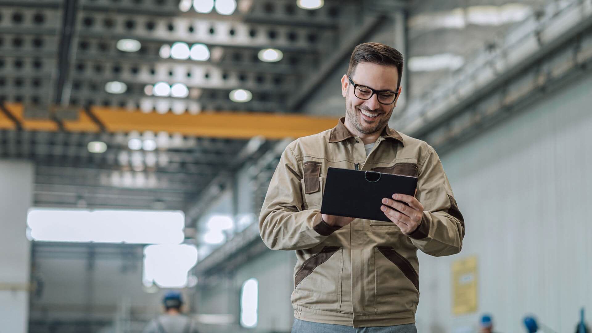 A VHIT employee using a tablet in the manufacturing facility. 